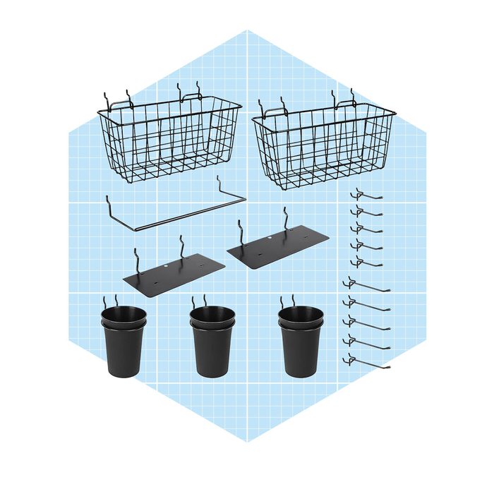 A set of black wire baskets and plastic cups is arranged on a light blue grid background, intended for storage or organization purposes.