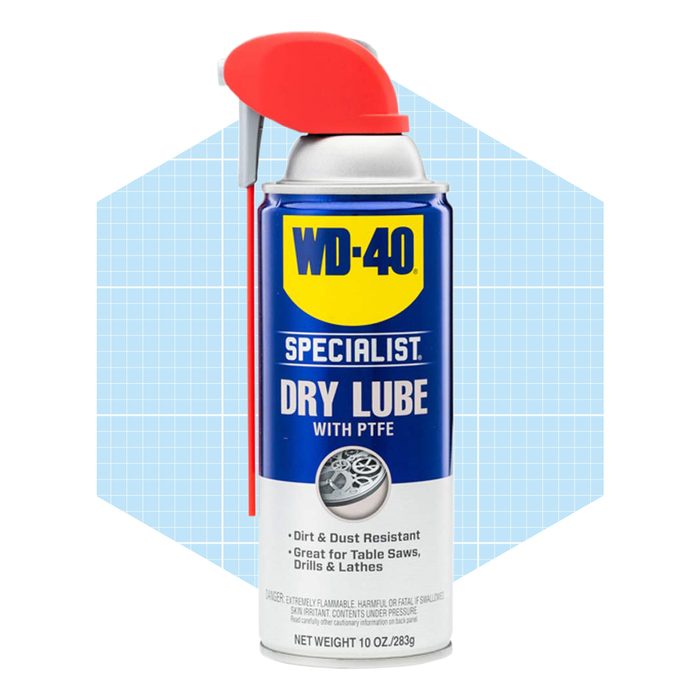 A blue and silver spray can labeled 