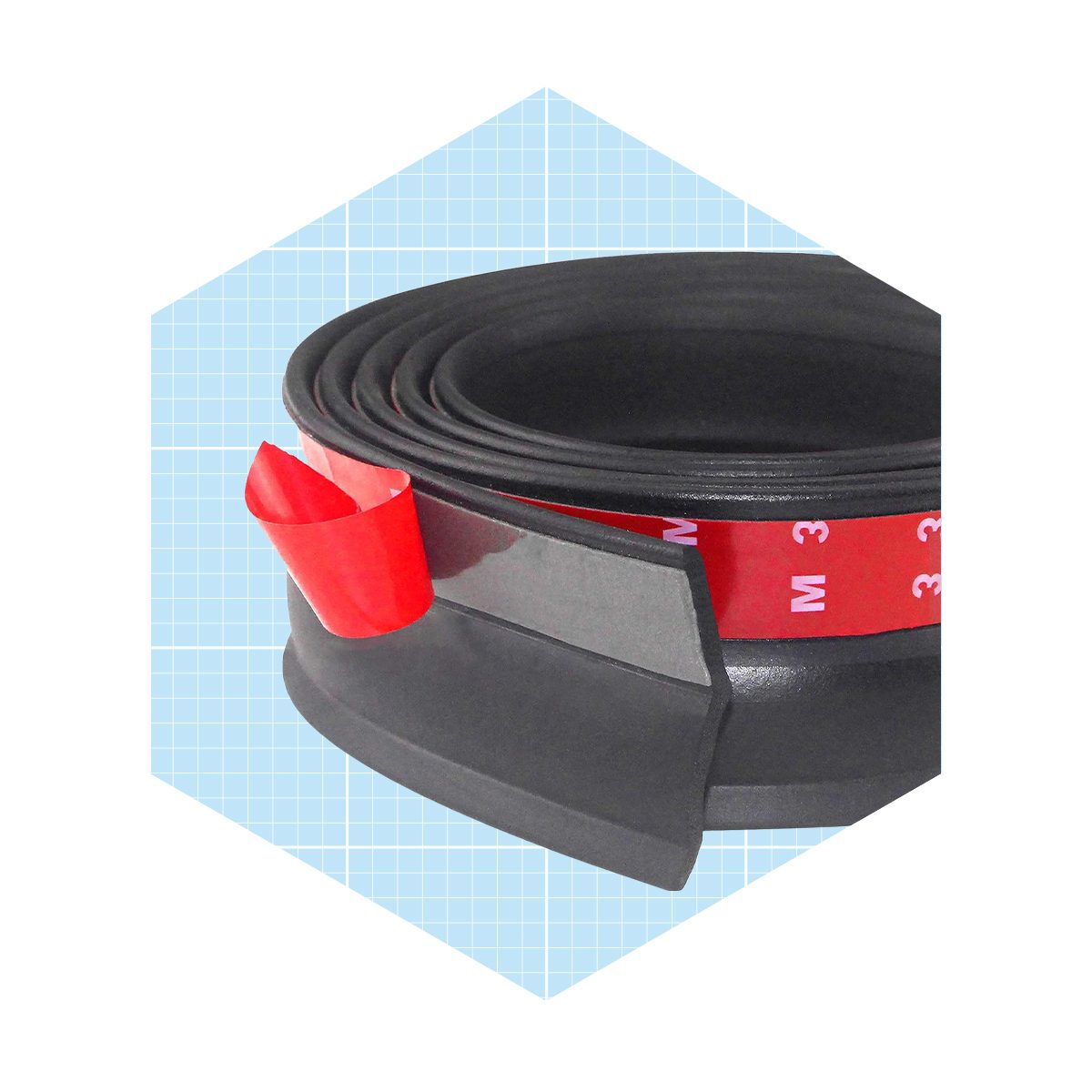 A rolled black adhesive strip rests on a grid-patterned light blue background, with a red tab visible, indicating where to peel for application.