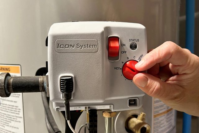 How To Turn On A Water Heater And Adjust Its Temperature Set the water heater thermostat