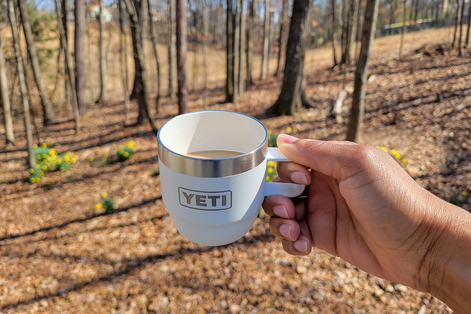 Holding Yeti’s New Stackable Cup in forest area