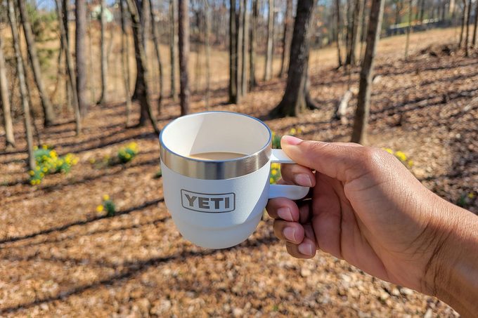 Holding Yeti’s New Stackable Cup in forest area