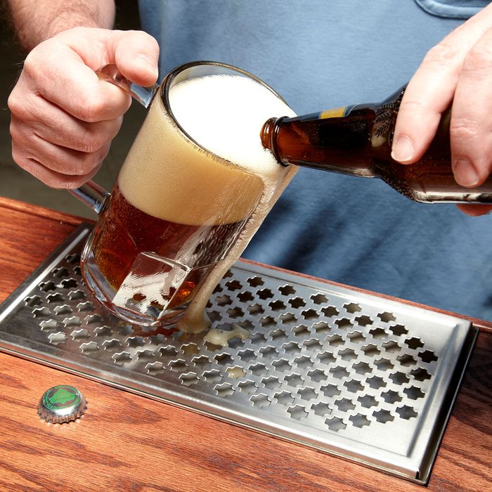 Pouring beer in beer mug