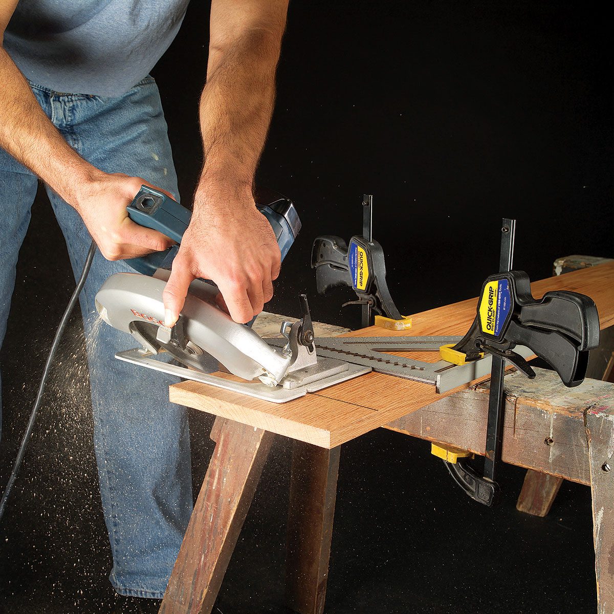Cutting wood with hand saw