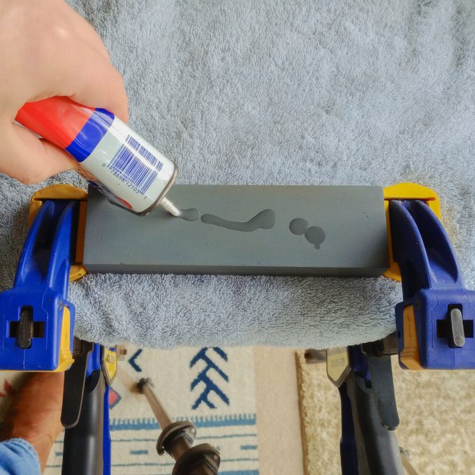 Applying household oil on whetstone