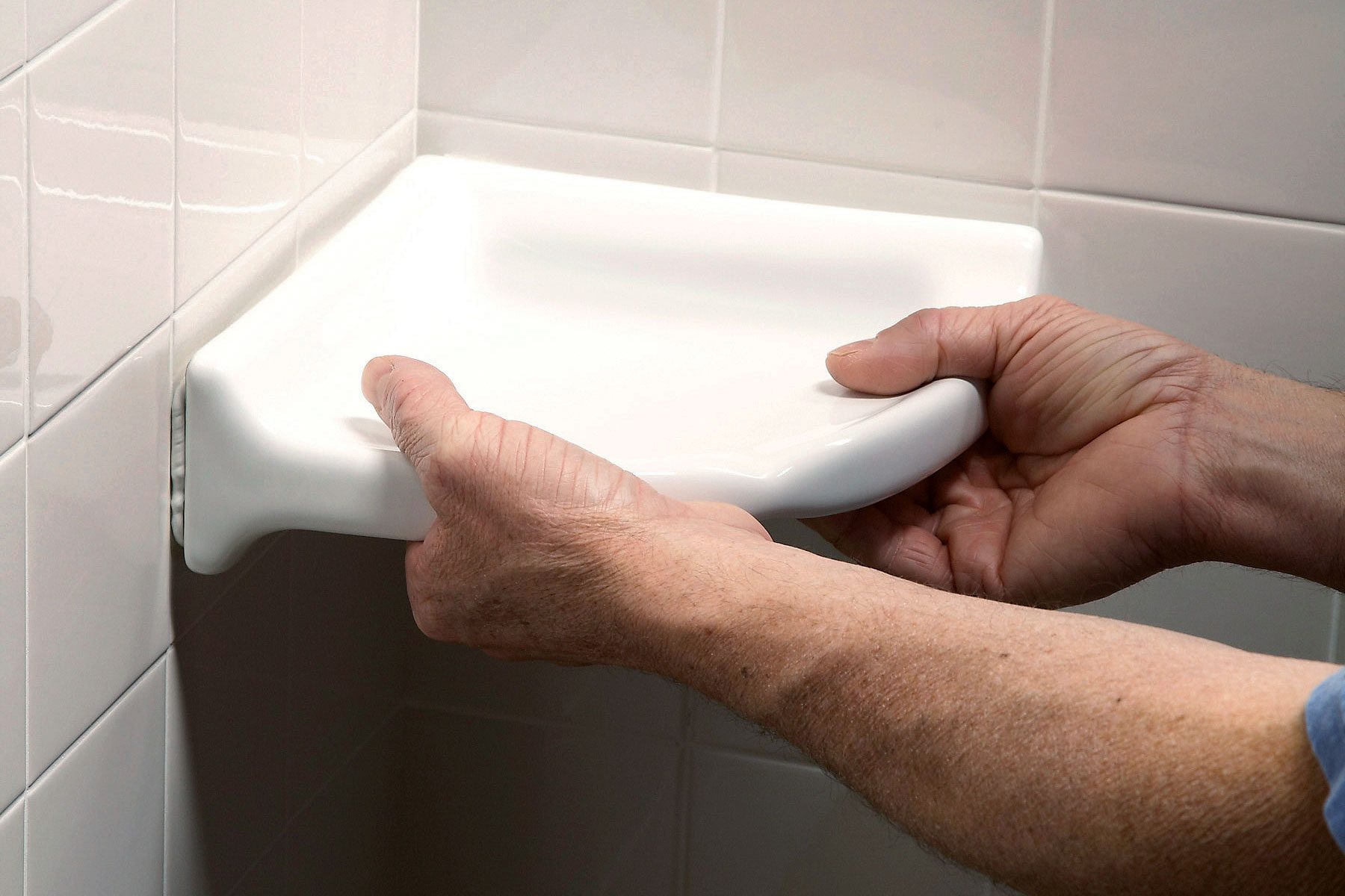 Installing corner shelf in a shower area