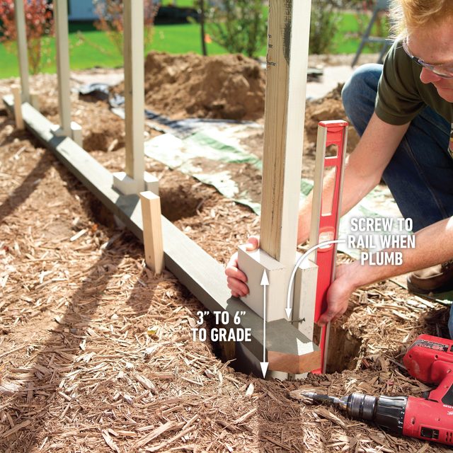 How To Build A Privacy Screen On Your Patio Dig the Holes and Set the Posts