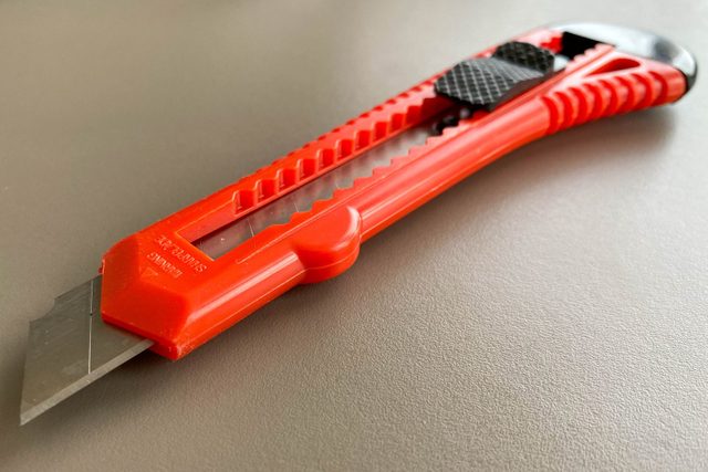 Red sharp utility knife