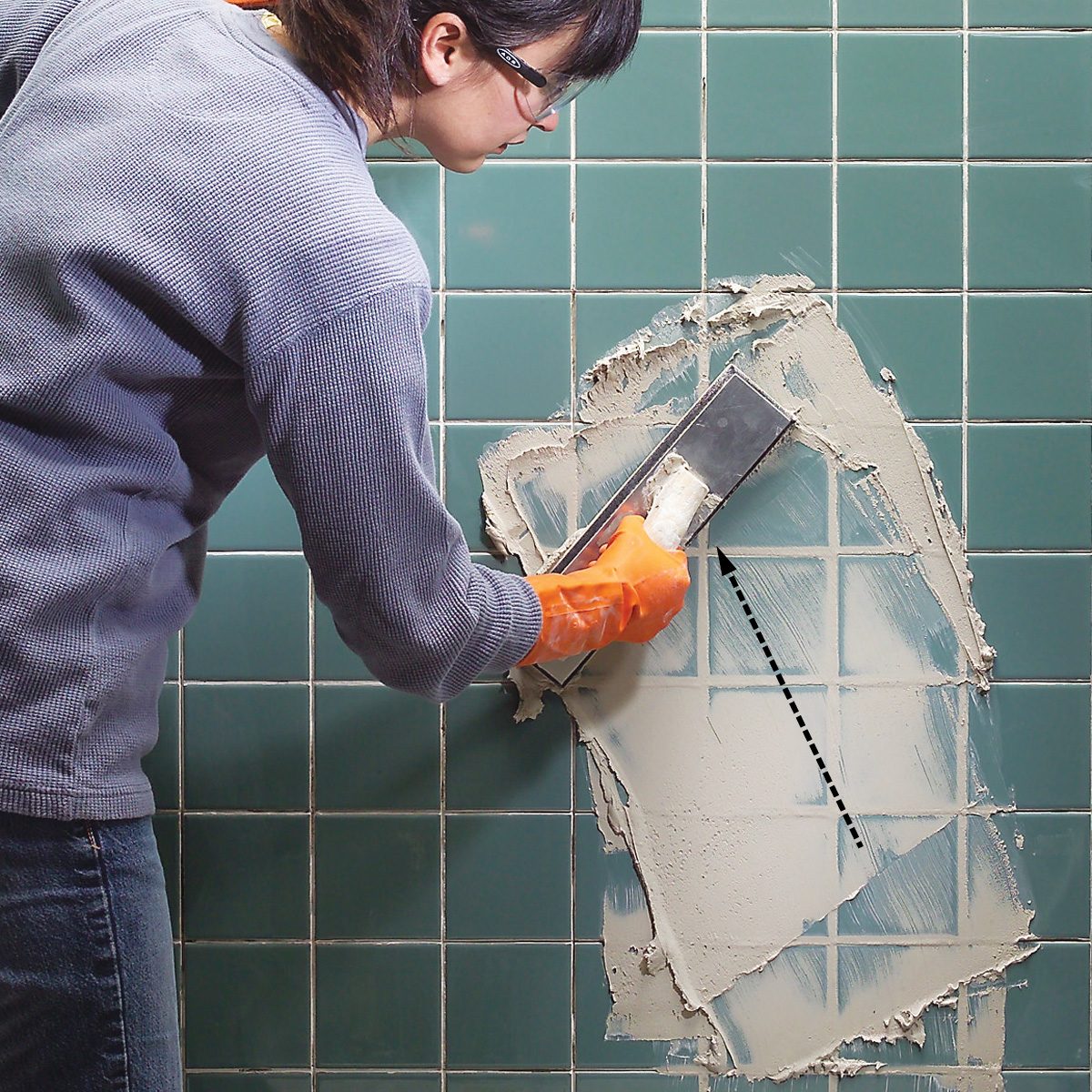 Slice out caulk and scratch out grout