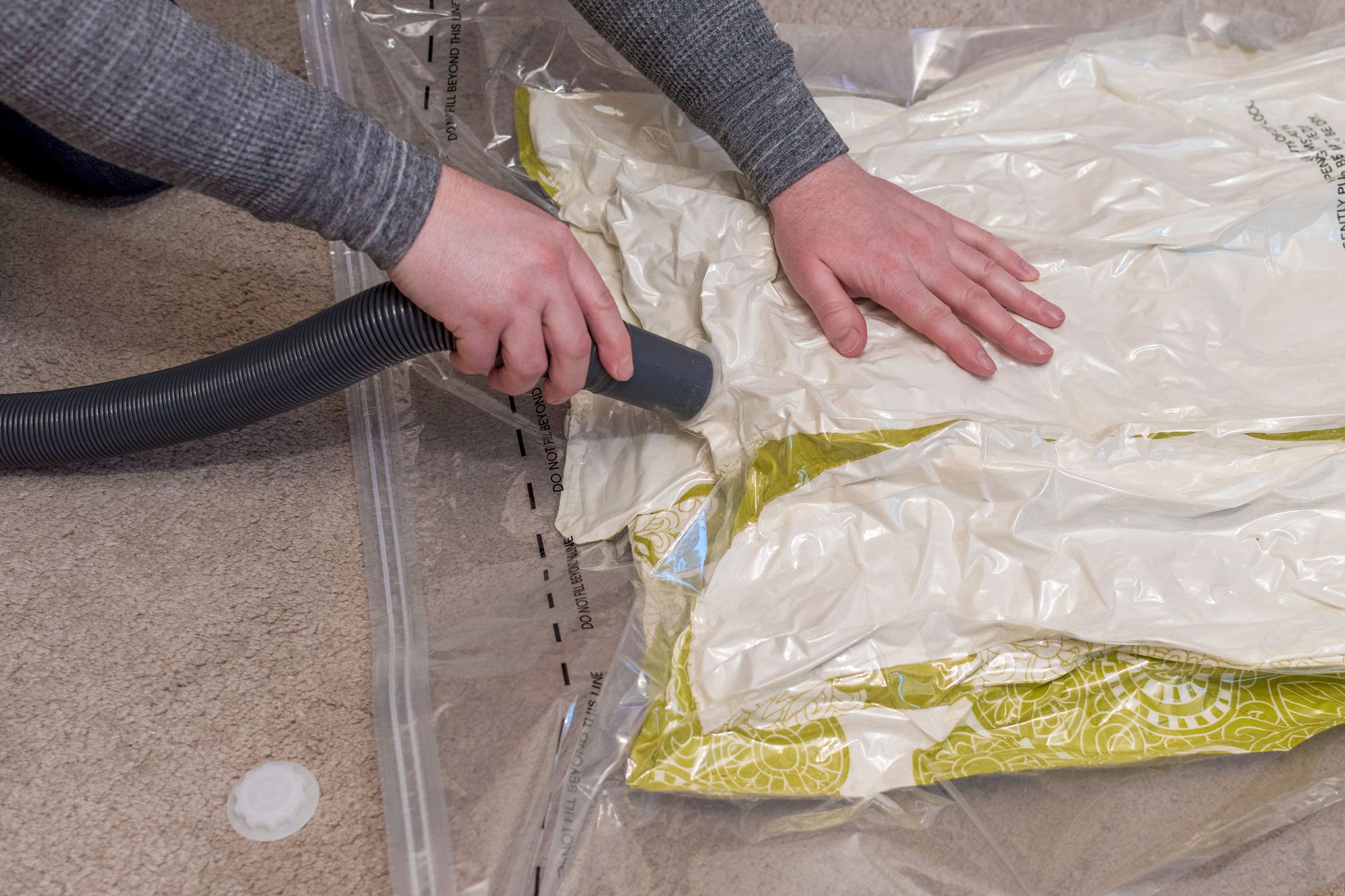 Using A Vacuum Storage Bag To Remove Air From Duvet