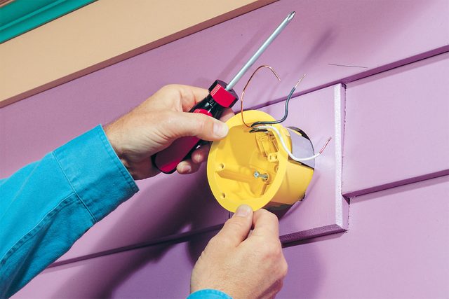 Wires run inside an electrical box.