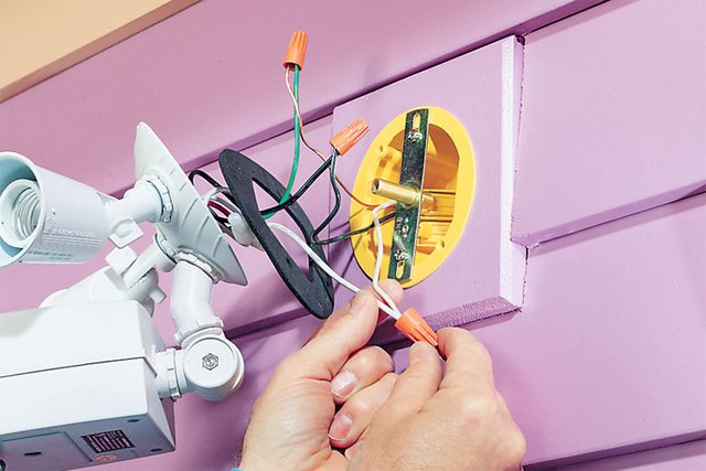 Wire connectors screwed onto wire pairs pulled out from fixture