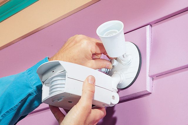 fixture screwed to the crossbar using the screws.