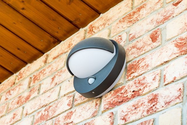 Motion Sensor Light on a brick wall.