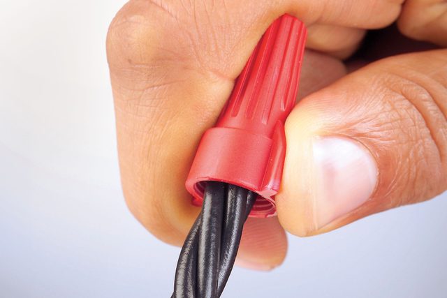 Wire nut being used to connect wires.