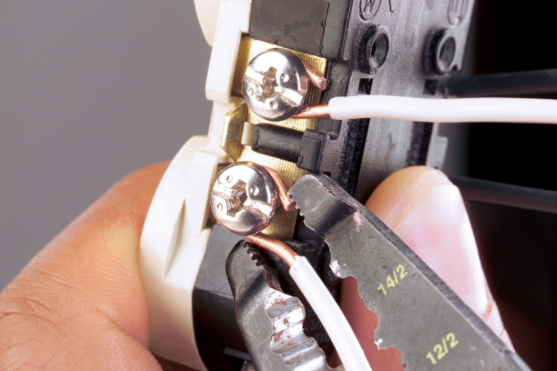 Wires being connected through a screw terminal.