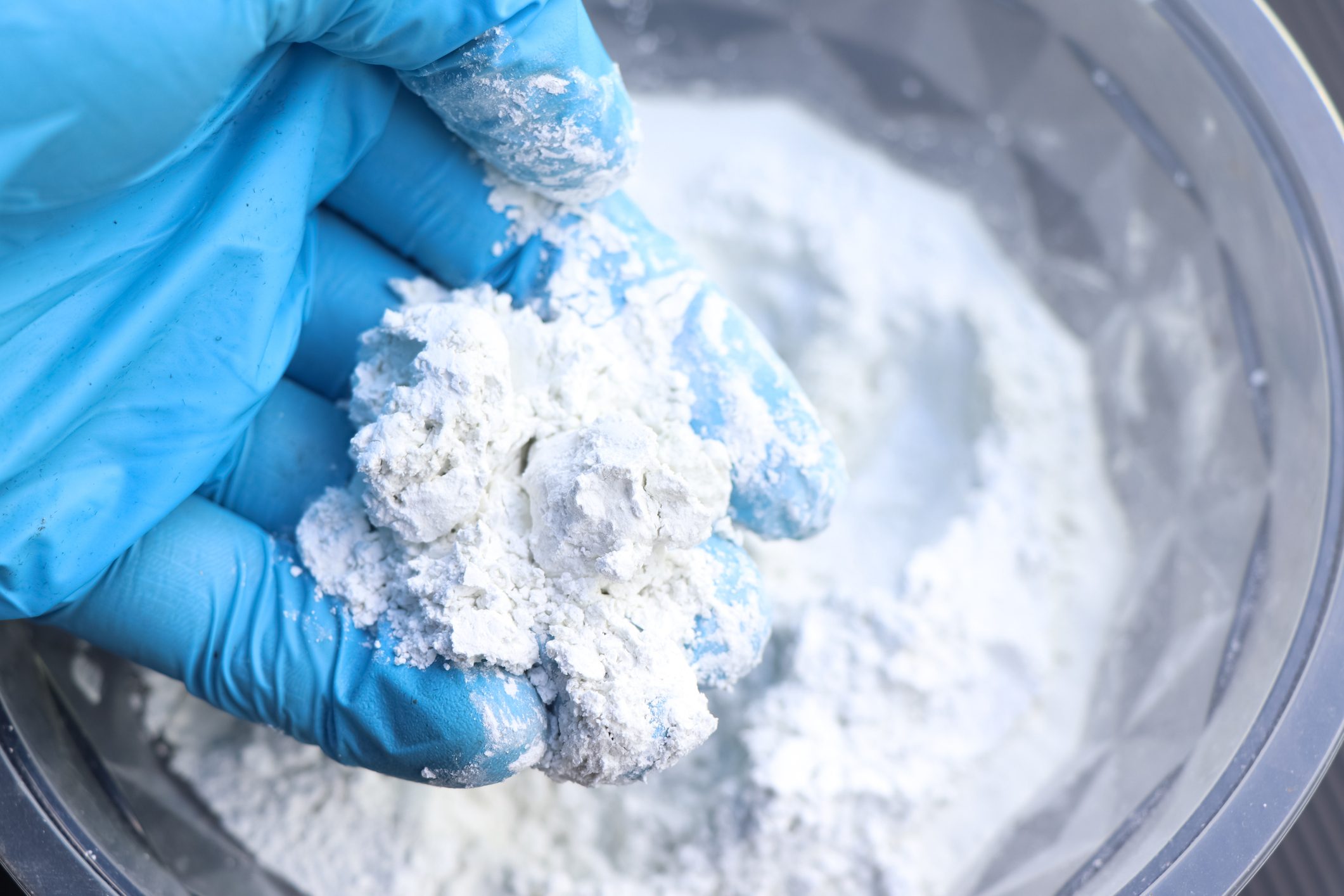 mixing grout in a bucket for mechanic work