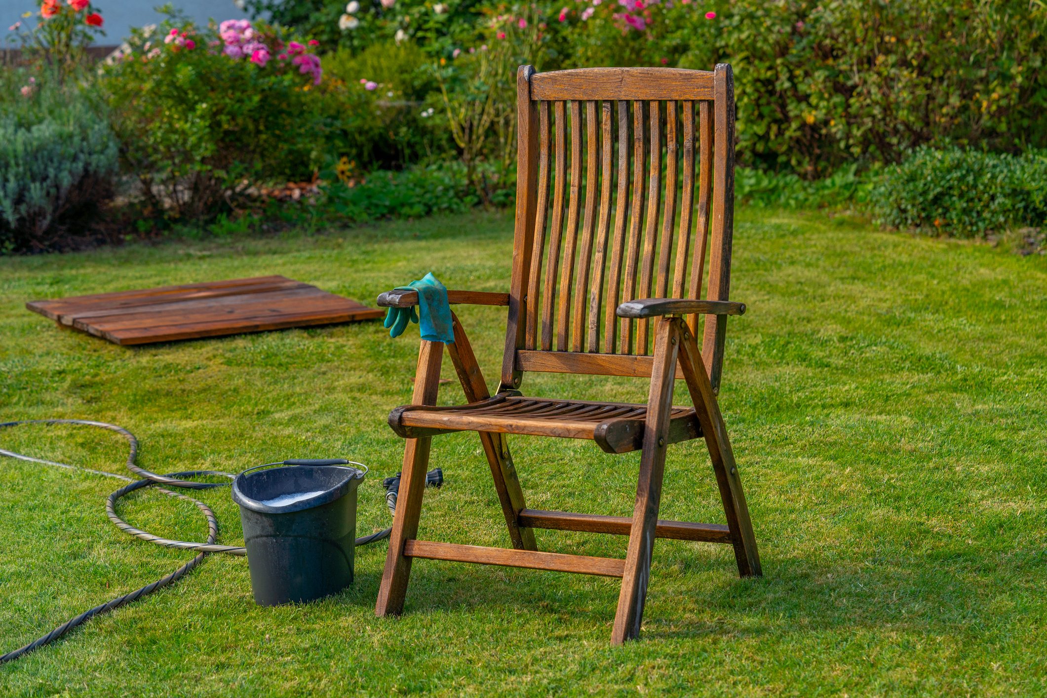 Wood furniture cleaning, wooden garden chair - care and maintenance of wood with water and mild detergent