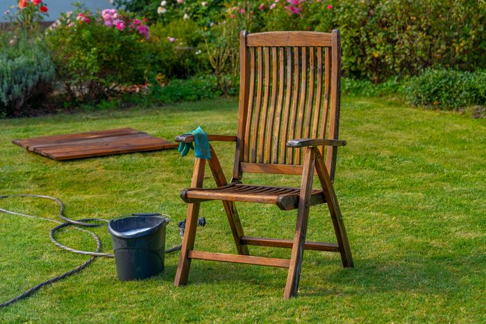Wood furniture cleaning, wooden garden chair - care and maintenance of wood with water and mild detergent