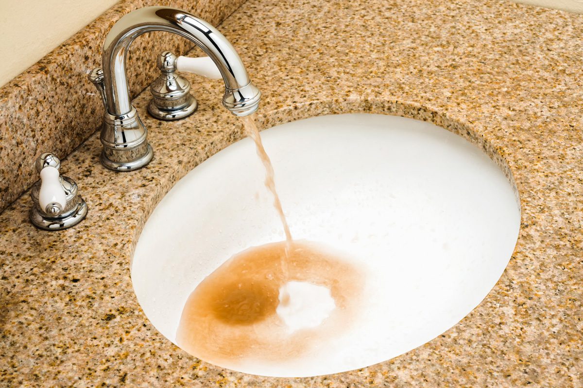 dirty water pouring out of faucet