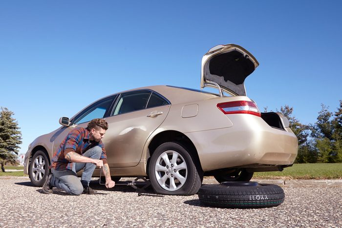 man changing car tires