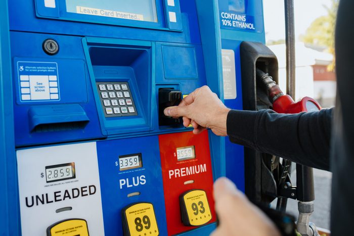 man purchasing gas at gas station