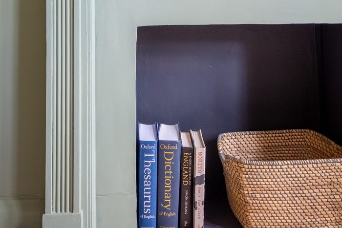 a basket and some books inside a fireplace