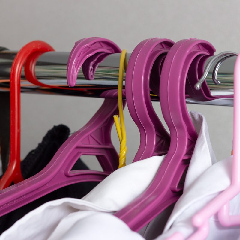 hangers with clothes in a closet