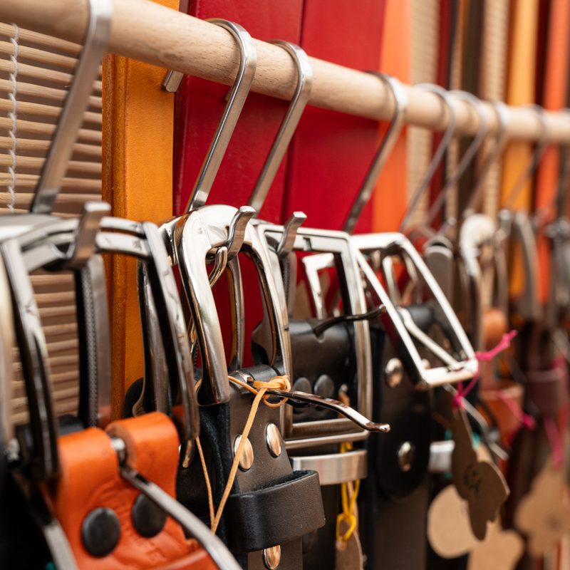 belts hanging on s hooks