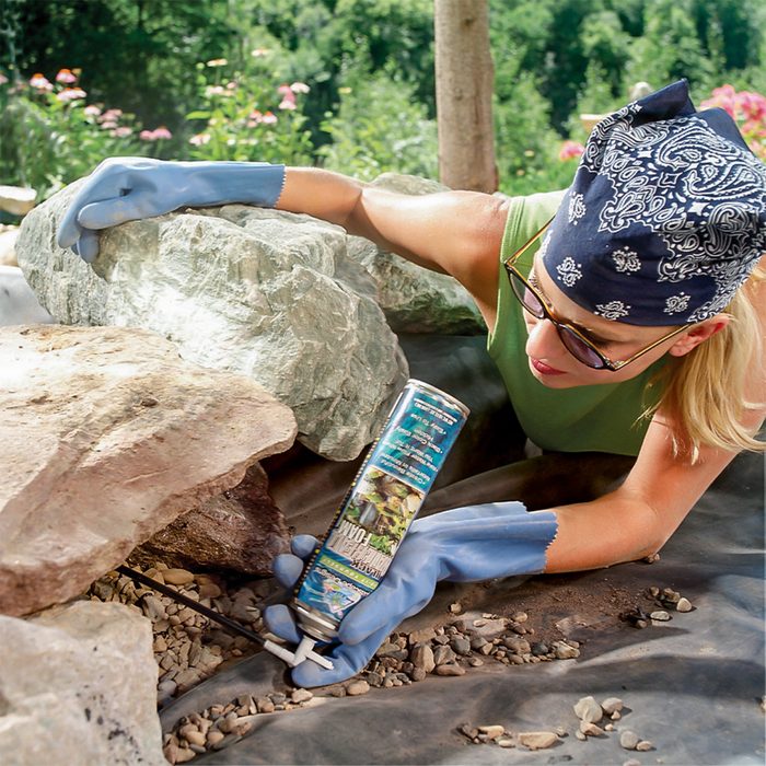 woman using landscaping foam