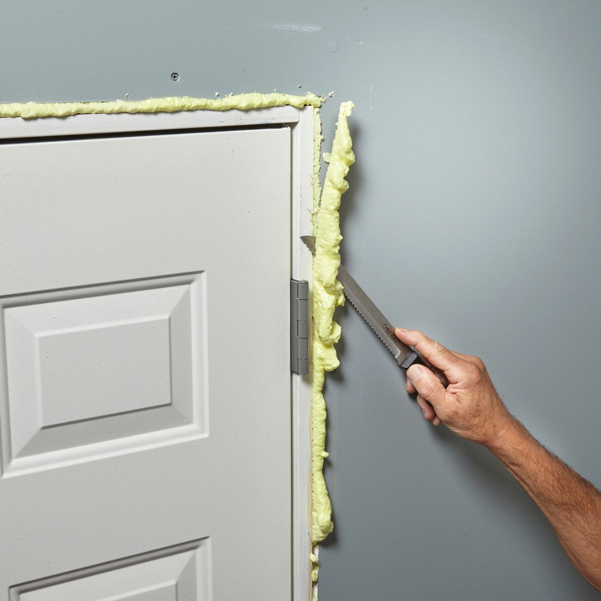 cutting off excess foam with bread knife