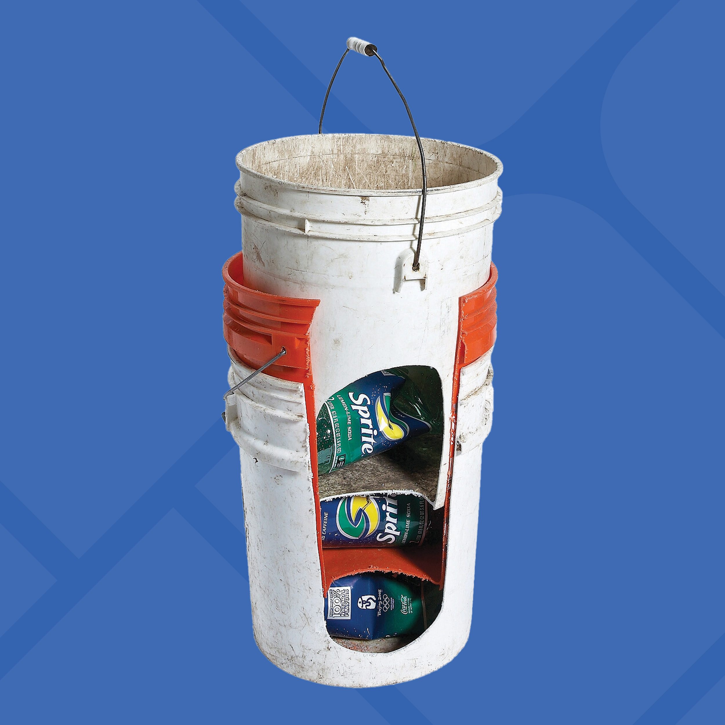 A white bucket with a large cutout displays three cans inside, including Sprite and Seagram