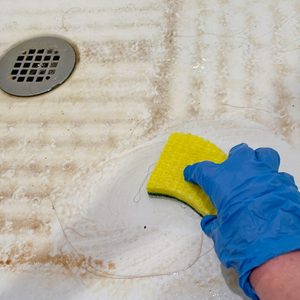 scrubbing mouldy bathroom surface