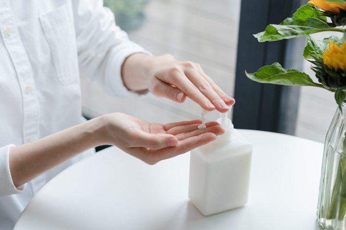 Woman applying lotion