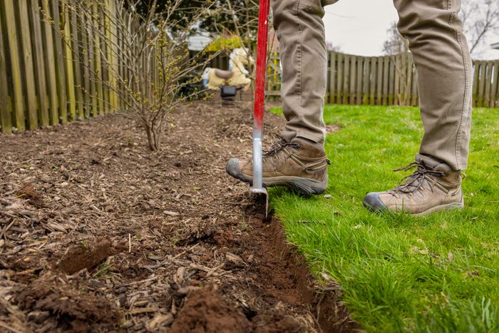 Worker Edging Mulch Bed