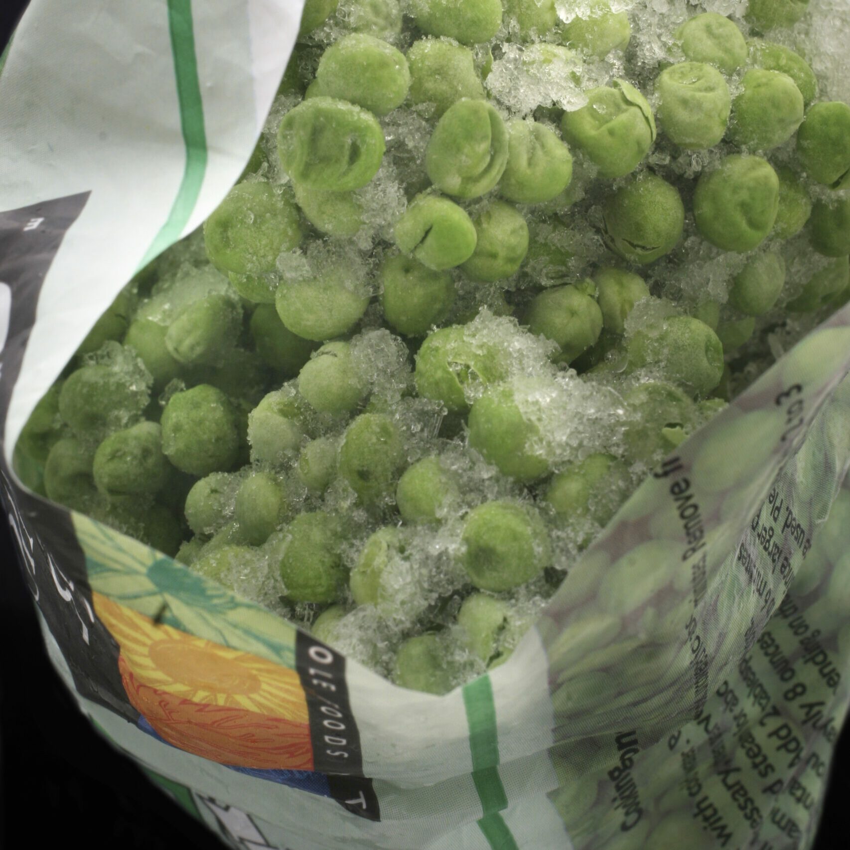 Freezer-burned peas in a plastic bag package