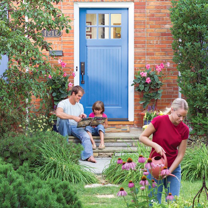 family in garden outside their home
