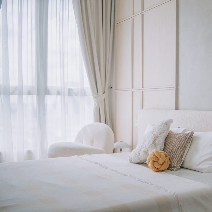 brightly lit bedroom beside window