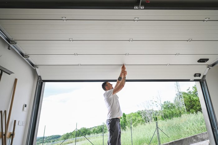 Installing garage door.