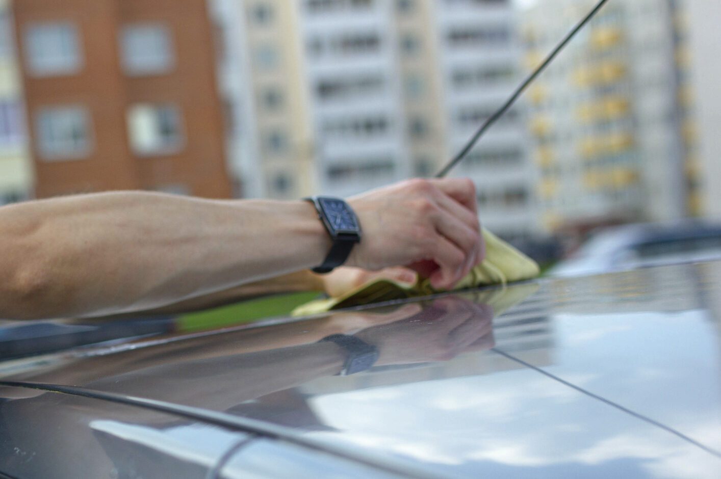 A man fixing car antenna