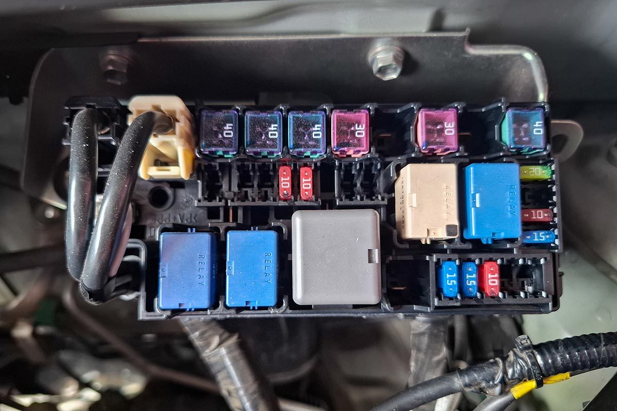 A box containing fuses and electrical relays for car vehicles