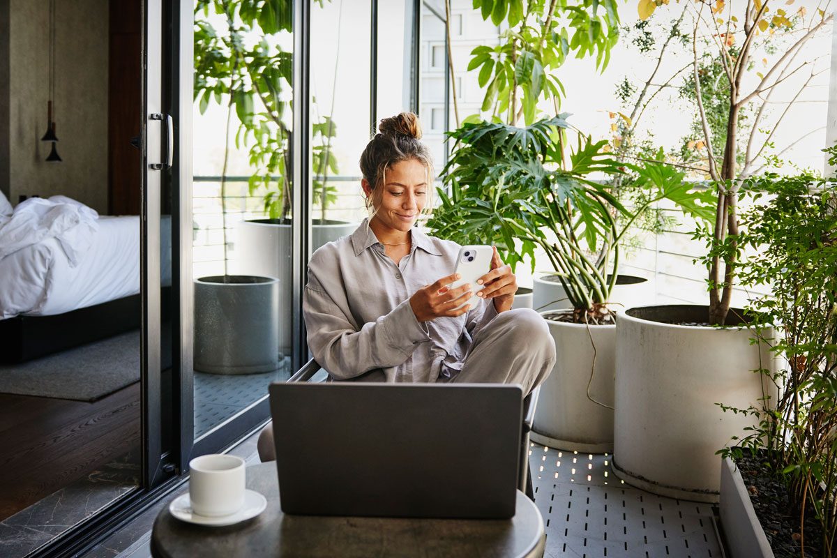 Smiling Woman Checking Smart Phone