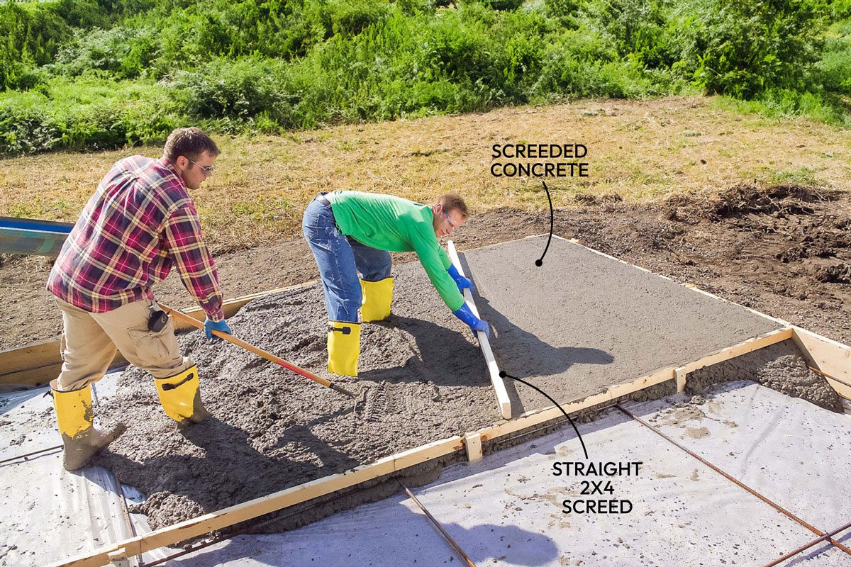 Wide shot; Step 7 Prepare, Pour and Level the Concrete; Drag a straight 2×4 (screed board) across the top of the concrete forms to level and begin to finish the concrete surface; Make multiple passes if needed to create a flat, evenly filled area; Have a helper add or remove concrete in front of the screed as you pull it;