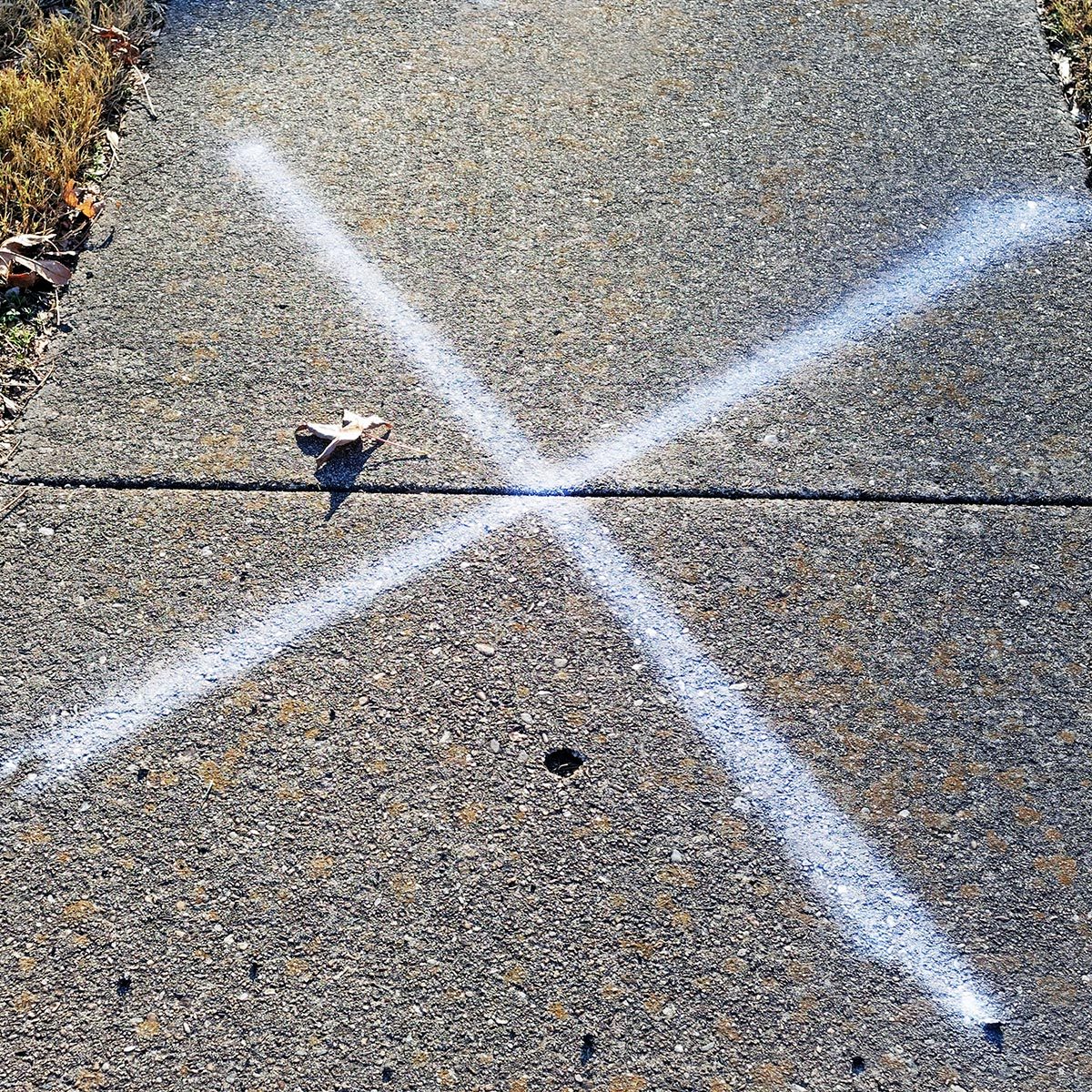 A Chalk X On Your Sidewalk Could Be a Security Concern