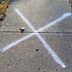 A Chalk X On Your Sidewalk Could Be a Security Concern