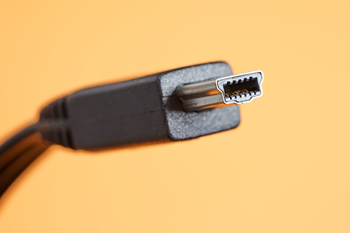 Front view of Mini USB connector on yellow background