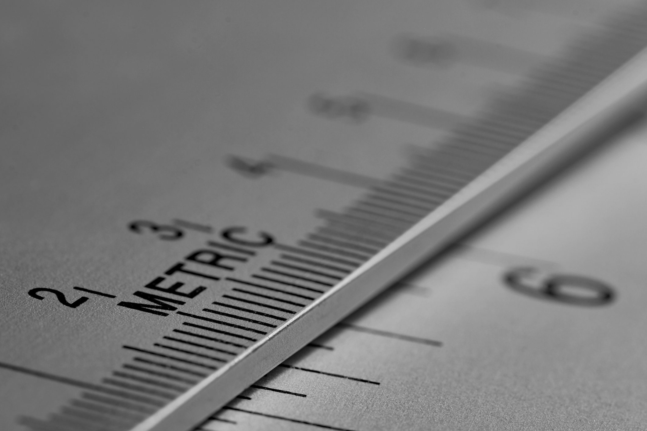 Stainless steel artist ruler focus on word Metric