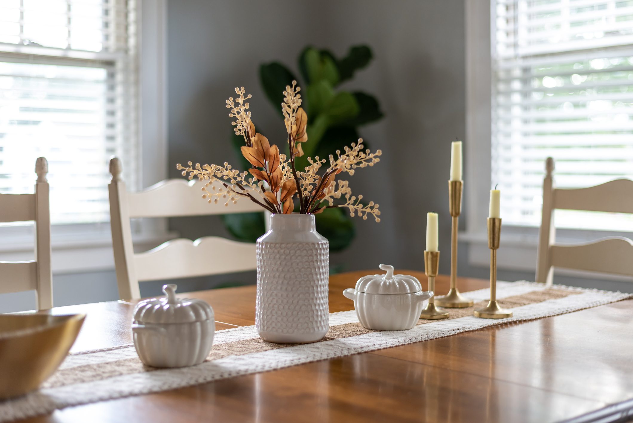 Dining room table with stylish fall decorations