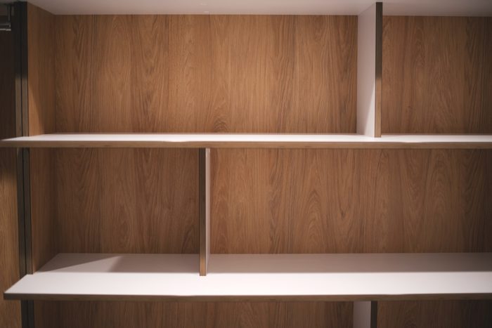 Dressing room with empty shelves. Wardrobe. Furniture. Interior design element.