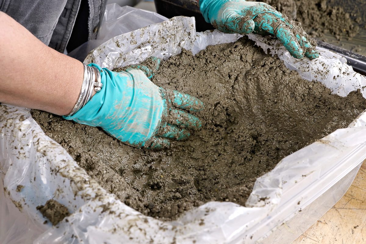 Transferring the Hypertufa mix into the plastic tub